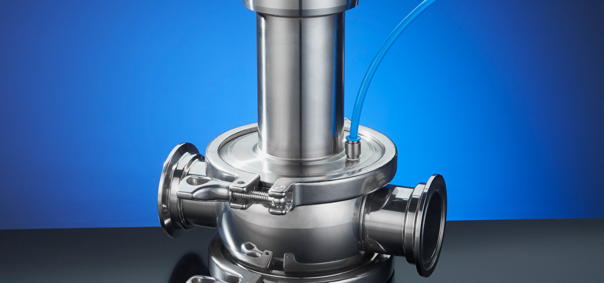 silver food and beverage valve against a blue background